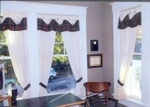 Cuffed valance over tab top panels, custom window treatments and drapery