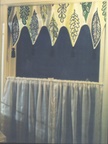Shaped valance over rod poket panels, custom window treatments and drapery