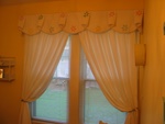 Shaped valance over rod pocket panels, custom window treatments and drapery